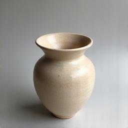 Hand-thrown ceramic vase with subtle texture.